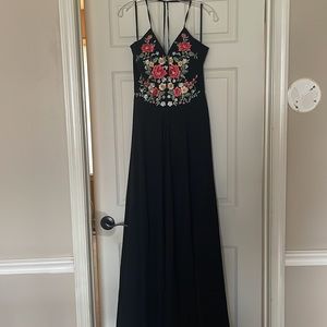 Black prom dress. Floral pattern top. Beaded work on top